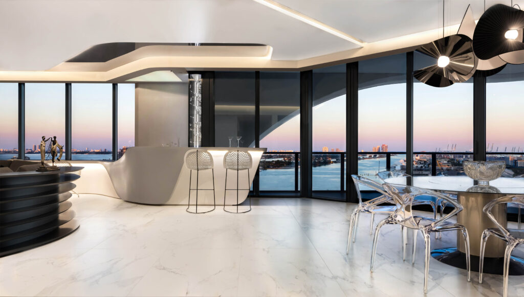 Luxury condo interior design at One Thousand Museum Miami with sculptural bar and Biscayne Bay views