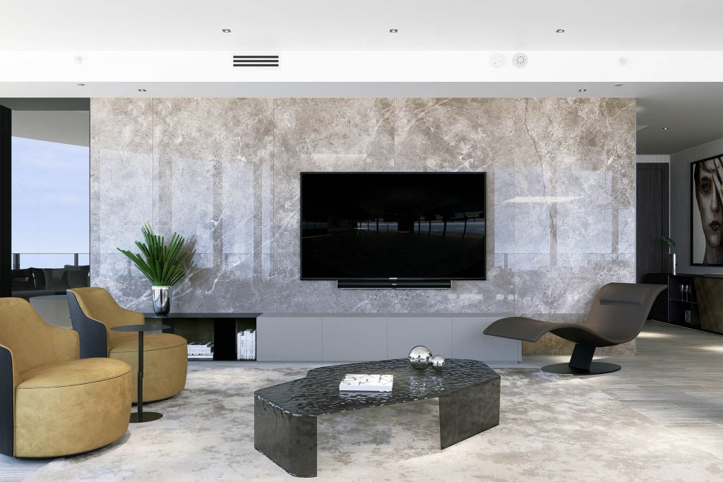 Contemporary and minimalist living room mixing light and dark finishes, warm tones, black hammered glass coffee table, mustard lounge chairs, brown chaise, media wall in grey and brown marble.