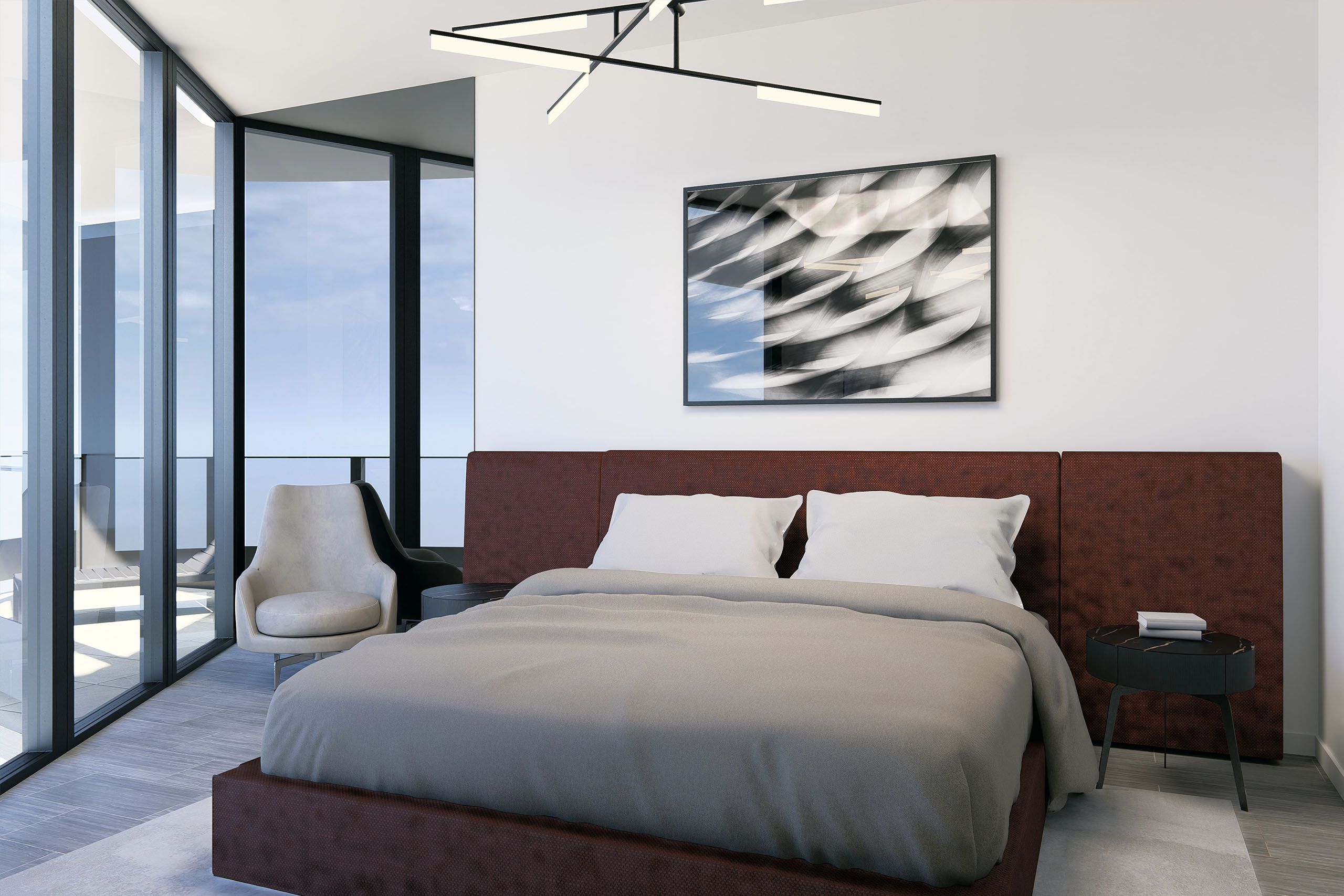 Contemporary and minimalist interior design with asymmetrical bed wall with smoke mirror on the left side, burgundy bed with long headboard, white rug, white walls, white lounge chair, black wood rounded nightstands and black and white abstract artwork.